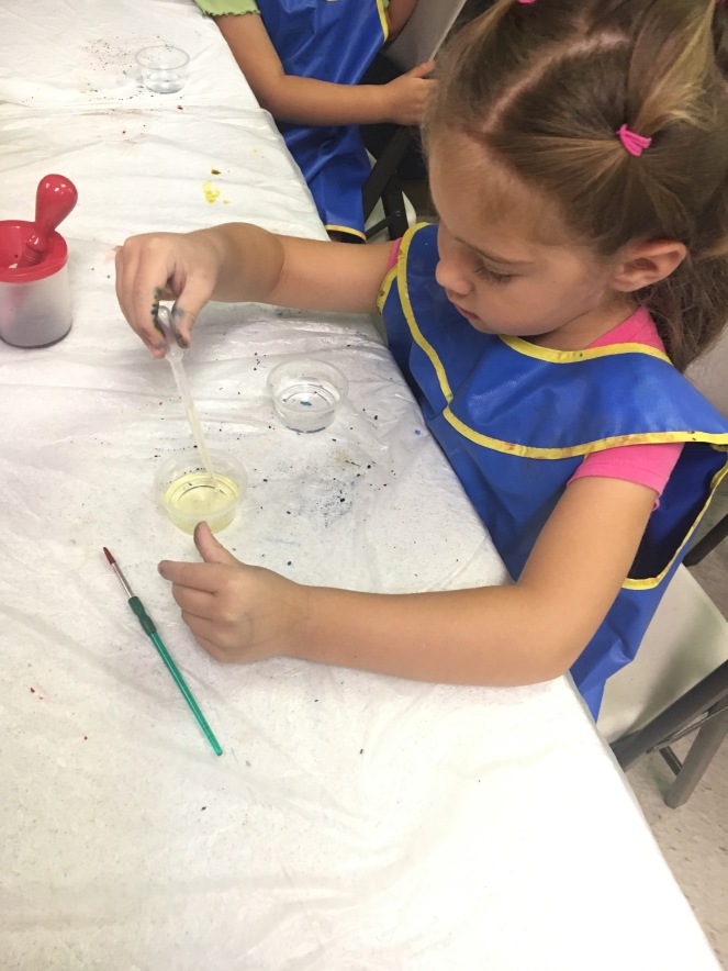 Mixing oil and water in art class 